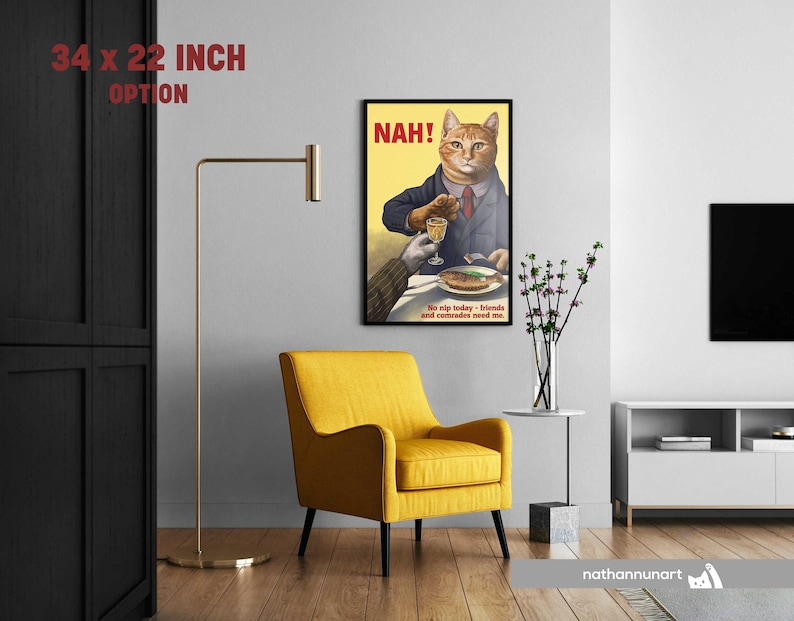 May include: A framed art print featuring a cat in a suit holding a glass, with the word "NAH!" in red. The print measures 86 x 56 cm. The text "No sip today - friends and comrades need me" is at the bottom. A yellow chair and gold lamp are in the room.
