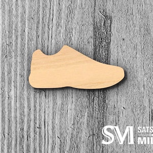 May include: A wooden cutout of a shoe in the shape of a sneaker. The cutout is unfinished and ready to be painted or stained.