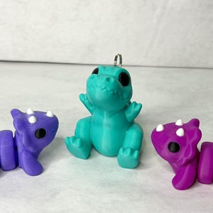Dinosaur Keychain, articulating keychain, trex, triceratops, 3D printed keychain, Dinosaur gift, Pink Dino, 3D Printed Accessory, Fidget