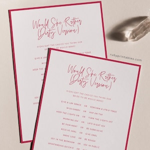 May include: Two white cards with a deep pink border and text that reads "Would She Rather (Dirty Version)". The cards have a list of questions and choices. The website rubyprintables.com is visible in the image.