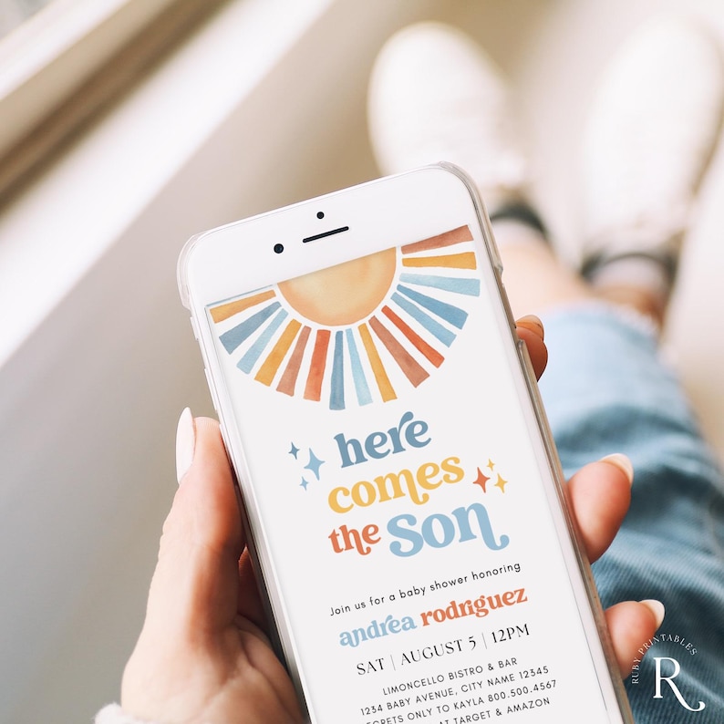 May include: A phone screen displaying a baby shower invitation with a colorful sun graphic and the text "here comes the Son". The invitation is for Andrea Rodriguez and is scheduled for Saturday, August 5th at 12pm at Limoncello Bistro & Bar.