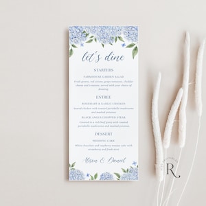 May include: A wedding menu with a blue and white floral design. The menu lists the starters, entree, dessert, and the names Alison and Daniel. The text "let's dine" is written in a decorative font.