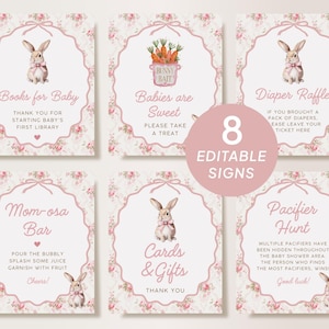 May include: Eight editable baby shower signs with a floral and bunny theme. Each sign has a pink border and features text like "Books for Baby" and "Diaper Raffle". The signs are designed for a baby shower.