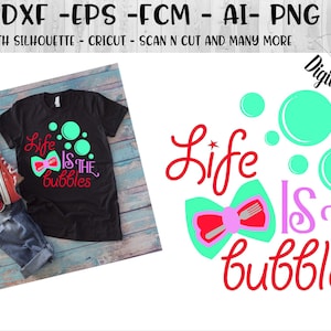 May include: A digital design featuring the text "Life is the bubbles" in red, pink, and turquoise with a bow and bubbles. The design is on a black t-shirt with blue jeans and red shoes.