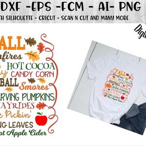May include: A white t-shirt with a fall-themed design featuring the text "FALL" and a list of fall activities, including bonfires, hot cocoa, candy corn, football, smores, carving pumpkins, hayrides, apple pickin', falling leaves, and hot apple cider.