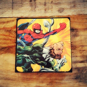 May include: A comic book cover featuring a green and black superhero fighting a red and blue superhero with a yellow background.