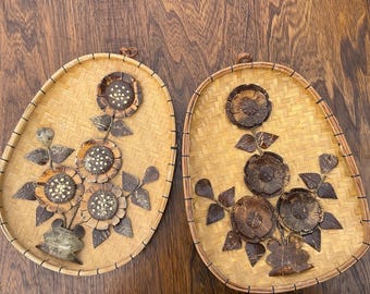 Kitschy carved coconut flower wall decor on woven basket oval frame mcm 70s floral travel art decor for beachy boho eclectic swinger vibe