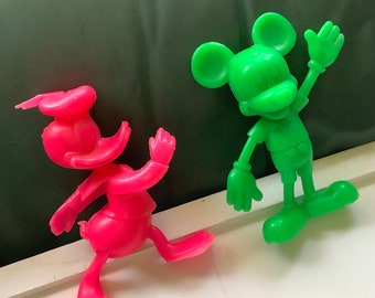 Vintage Disney Mickey Mouse and Donald duck neon pink green hard plastic figures, pair of collectible Marx dolls retro display bright colour