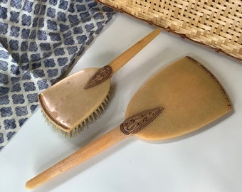 Art Deco hand mirror and brush early plastic peach vanity set, celluloid Bakelite casein Catalan phenolic resin, Art nouveau dresser set