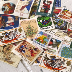 May include: A collection of vintage Christmas stamps featuring various holiday themes, including Santa Claus, a Christmas tree, a dove, and a rocking horse. The stamps are from different countries and years, and some have the words "Canada" and "US Postage" printed on them.