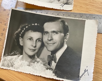 Pair of professional wedding portraits young husband wife cute vintage black white studio prints anniversary flower headband bow tie 60s mom