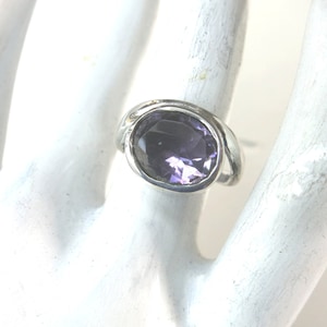 Silver ring, wavy ring body and Amethyst in closed setting