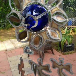 Sunflower wind chime with Angels and hearts hand cut out of stainless steel with 3 inch blue glass float.