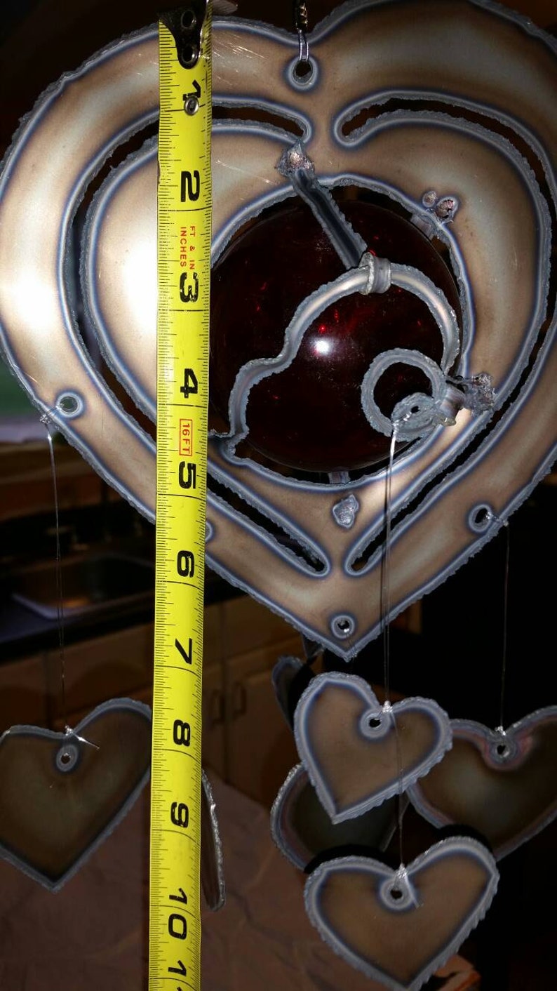 Heart lovers wind chime 3 inch red glass float with hearts hanging.
