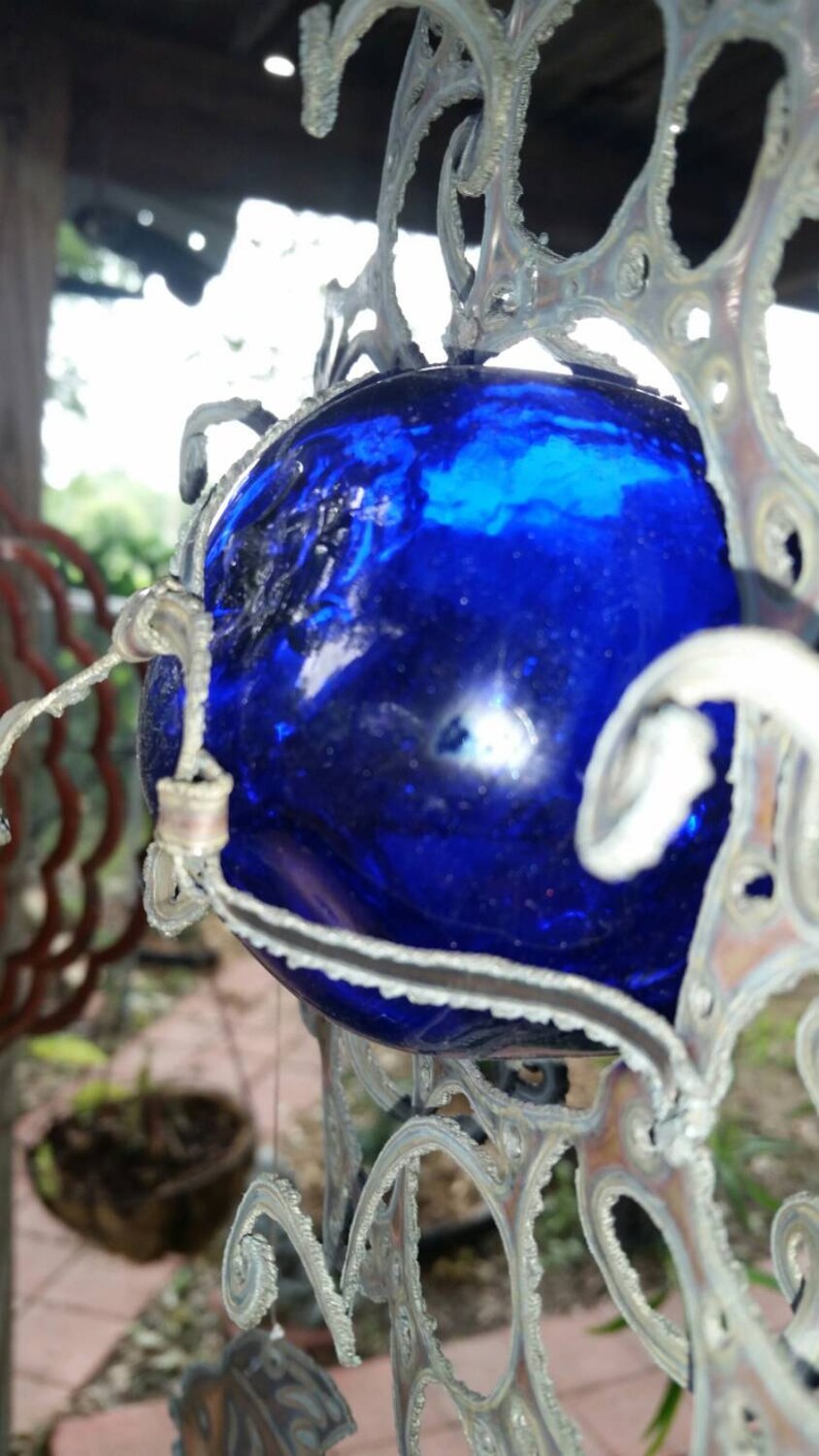 Tropical fish wind chime hanging from Sun with 3 inch blue glass float