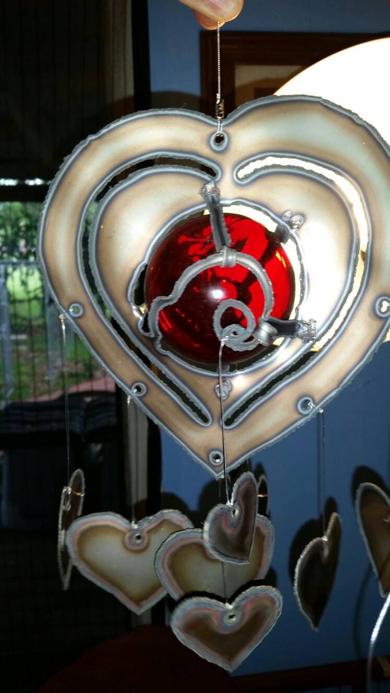Heart lovers wind chime 3 inch red glass float with hearts hanging.