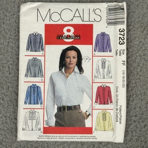 May include: McCall's sewing pattern featuring eight shirt designs. The pattern includes a woman wearing a white shirt. The pattern number is 3723, size FF (16-18-20-22). The text "Great Looks 1 Easy Pattern" is visible.