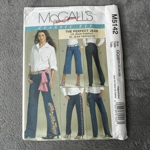 May include: A McCall's sewing pattern for The Perfect Jean. The pattern features illustrations of different jean styles, including flared and straight-leg designs. The pattern size is GGW (20-22-24-26).