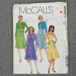 May include: McCall's sewing pattern envelope featuring illustrations of dresses with jackets. The envelope has the McCall's logo and the number M4871. The illustrations show dresses in green, blue, purple, and yellow.