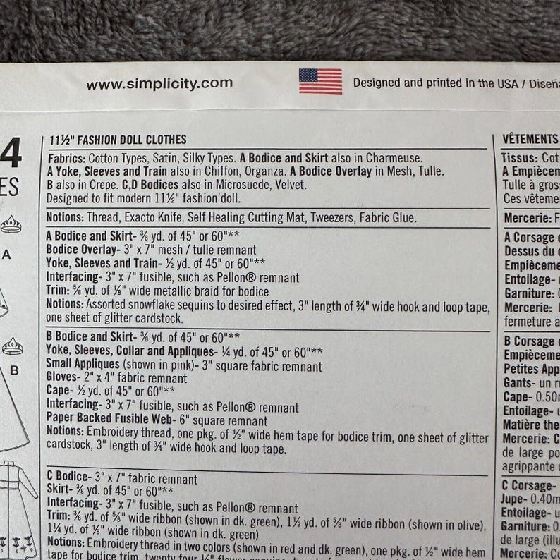May include: A close-up of a sewing pattern for 11 1/2 inch fashion doll clothes. The pattern includes instructions for a bodice, skirt, yoke, sleeves, and train. The pattern also lists required fabrics and notions.