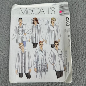May include: A McCall's sewing pattern envelope showing illustrations of women's blouses. The envelope is white with the McCall's logo and pattern number 2583. The size is G (20-22-24).