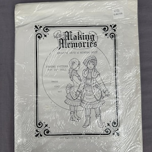 May include: A sewing pattern for a child's 1870s winter suit, designed for a 26-inch doll. The package features a black and white illustration of two children in winter attire. The pattern includes instructions for a dress, coat, and hat.