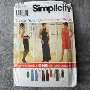 May include: Simplicity sewing pattern for dresses and robes. The package features images of three different dress styles, with a variety of looks. The text on the package reads "Design Your Own Dress/Robe" and "9 great looks. ONE simple pattern!"