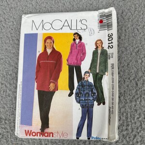 May include: A McCall's sewing pattern envelope featuring illustrations of women's outerwear. The envelope displays a red, pink, and green jacket, with the text "Womanstyle" and the pattern number "3012". The size range is RR (18W-20W-22W-24W-36-38-40-42).