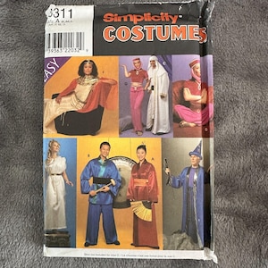 May include: Simplicity Costumes sewing pattern for making various costumes. The pattern includes a wizard, a Chinese dancer, a genie, a Greek goddess, and a belly dancer. The pattern is easy to use and includes instructions for all sizes.