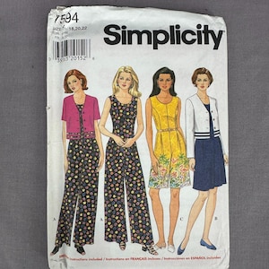 May include: Simplicity sewing pattern featuring illustrations of four different outfits. The pattern includes a jumpsuit, a dress, and a skirt suit. The pattern number is 7594, and the size is 18, 20, and 22.