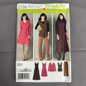 May include: Simplicity sewing pattern 2155, size AA 10-18, featuring illustrations of three outfits: a pink jacket and skirt set, a brown vest with trousers, and a floral print dress. Includes technical line drawings of the garments at the bottom.