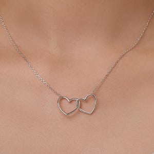 Collier coeurs entrelacés en argent sterling