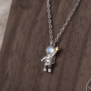 Astronaut Pendant Necklace in Sterling Silver with Lab Moonstone, Spaceman Holding Star Necklace, Space Planet Celestial Jewellery