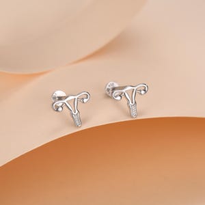 Örhängen i sterlingsilver med kvinnlig anatomi, 16G, platta baksida
