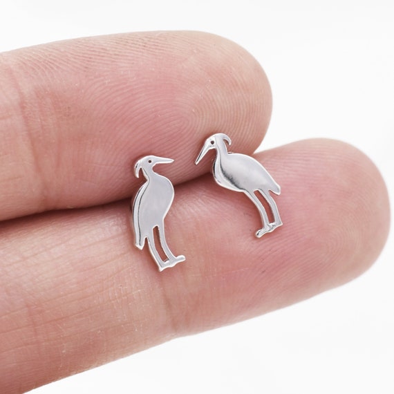 Sterling silver pink Egret studs. Sterling silver pink Egret studs.
