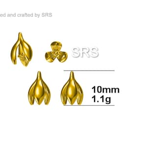 May include: Gold-colored metal flower-shaped embellishments. The image shows three different designs, including a flower and two tulip-like shapes. The text indicates a size of 10mm and a weight of 1.1g. The text "Designed and crafted by SRS" is also visible.