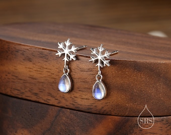 May include: Silver snowflake dangle earrings with iridescent moonstone teardrop drops.
