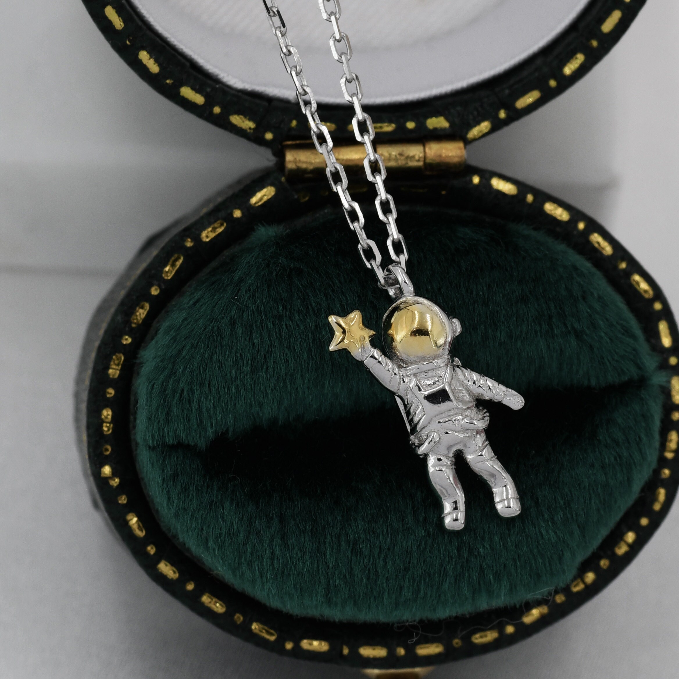 silver astronaut necklace