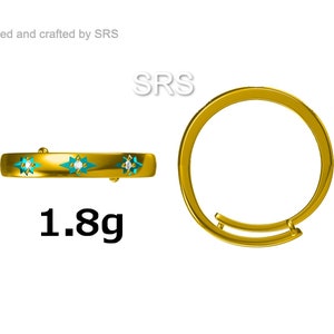 May include: Gold ring with three turquoise stars and a single diamond in the center of each star. The ring weighs 1.8 grams.  The ring is shown from two angles.