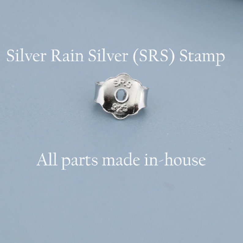 May include: A silver earring back with a scalloped edge and a central hole. The metal surface features the stamped text SRS and 925. The image includes the text Silver Rain Silver (SRS) Stamp and All parts made in-house.