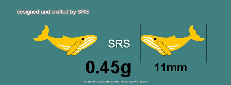May include: A yellow whale charm with white stripes, designed and crafted by SRS. The charm weighs 0.45 grams and is 11 millimeters in size.