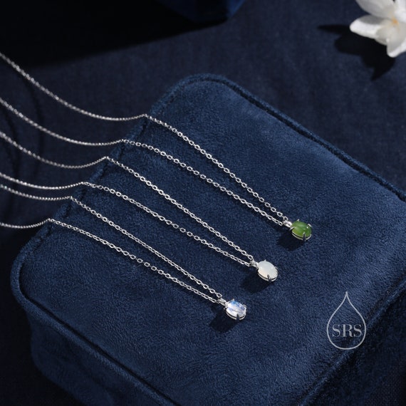 Rainbow Moonstone Sterling Silver 4x6mm Oval Stud Earrings Rainbow Moonstone Sterling Silver 4x6mm Oval Stud Earrings