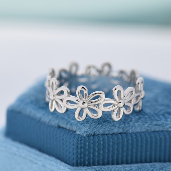 Genuine miniature flowers, set in sterling silver, available at natur