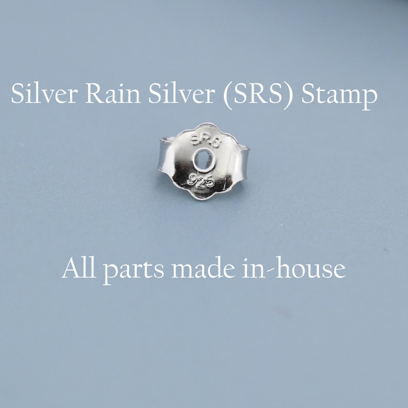 May include: A close-up of a silver earring back with the text "Silver Rain Silver (SRS) Stamp" and "All parts made in-house". The earring back is stamped with "SRS" and "925".