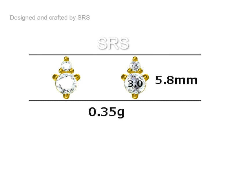 May include: Gold-tone earring with three clear cubic zirconia stones. The earring is 5.8 mm in diameter and weighs 0.35 grams.  SRS.