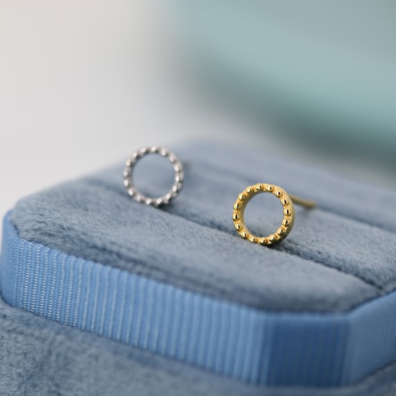 Sterling Silver Textured Hollow Oval Hoop Earrings and a pair of 4mm CZ Stud Earrings Sterling Silver Textured Hollow Oval Hoop Earrings and a pair of 4mm CZ Stud Earrings