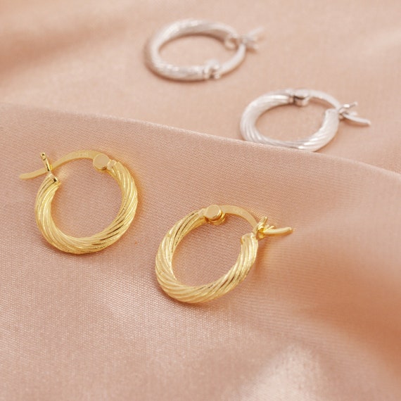 Gold braided hoop best sale earrings