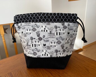 Black/grey barn & chicken wire with black corduroy on the front.  Drawstring project bag