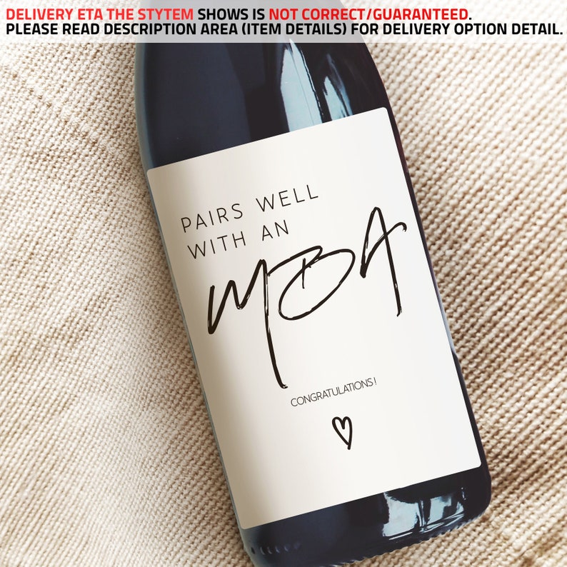 May include: A white wine bottle label with black text that reads "Pairs well with an MBA. Congratulations!" with a small heart symbol.