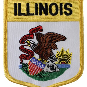 May include: A yellow and white embroidered patch with the state seal of Illinois. The seal features a bald eagle with a red, white, and blue shield, a rising sun, and the words "State of Illinois" on a scroll.